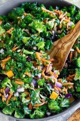 Easy Kale Salad in a bowl with a serving spoon