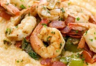 Shrimp and Grits served in a white bowl