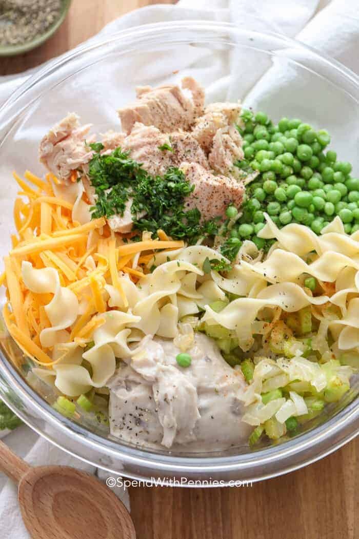 Tuna Casserole ingredients in a clear glass bowl before mixing together