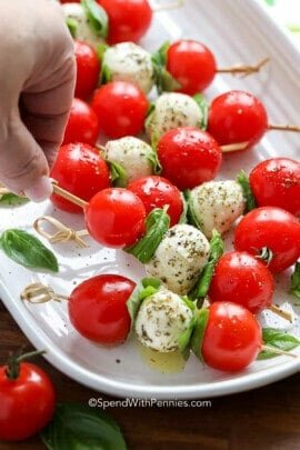 taking Caprese Skewers off the plate