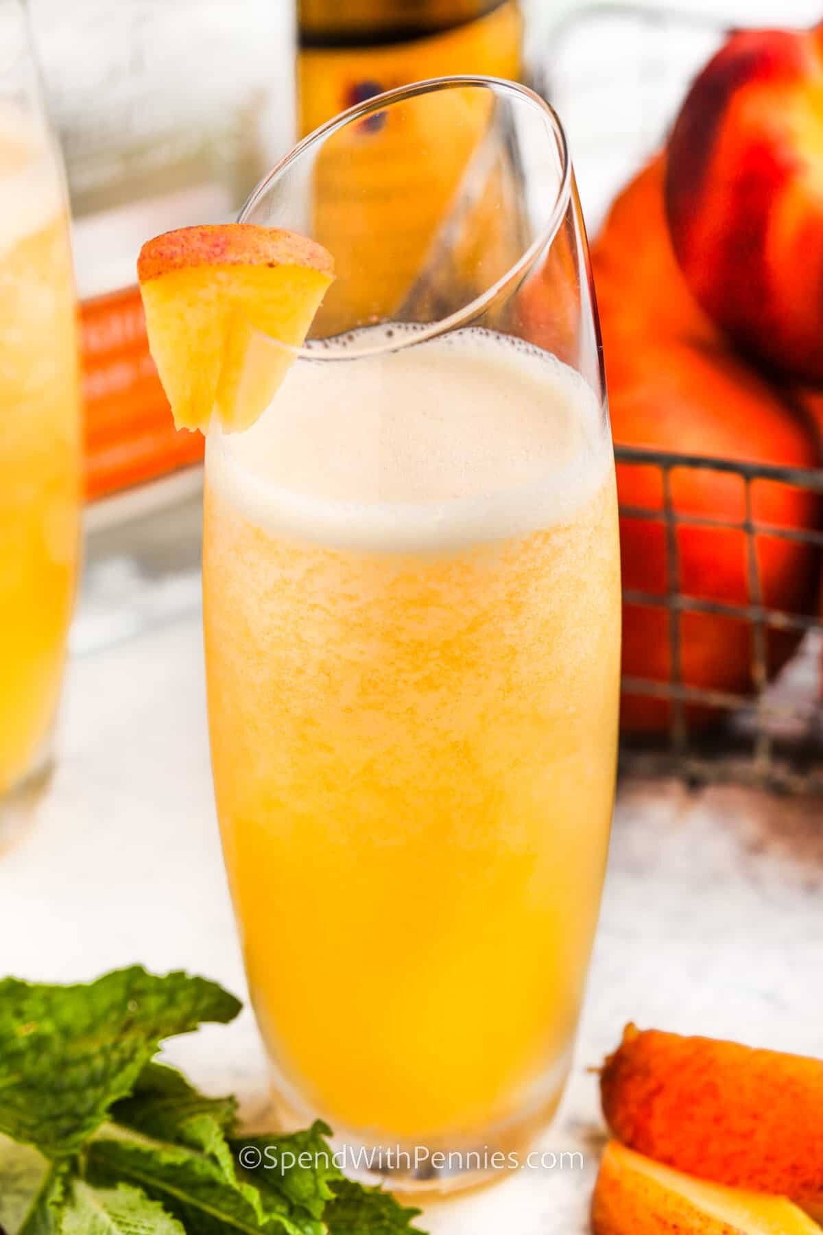 Peach Bellini with peach garnish