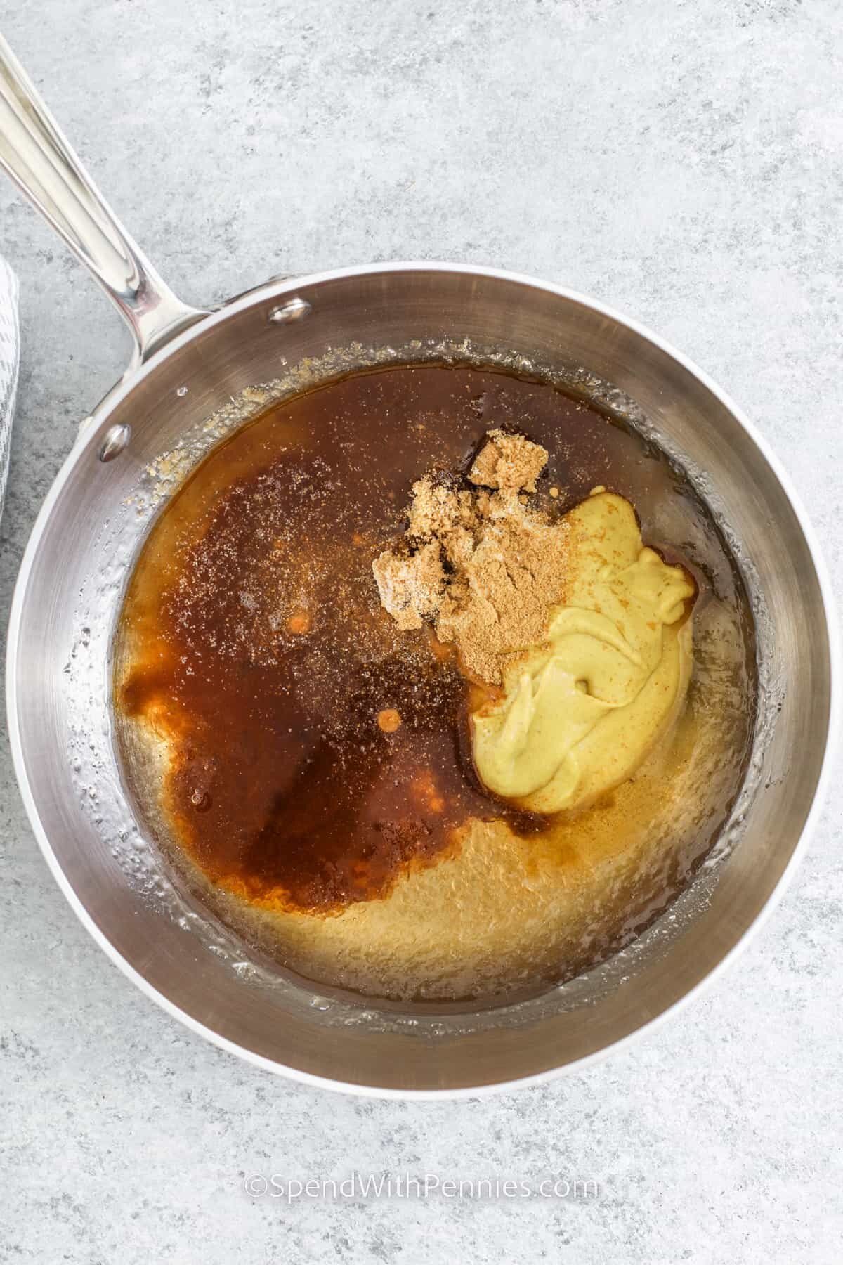 adding ingredients together to make glaze for Crock Pot Ham