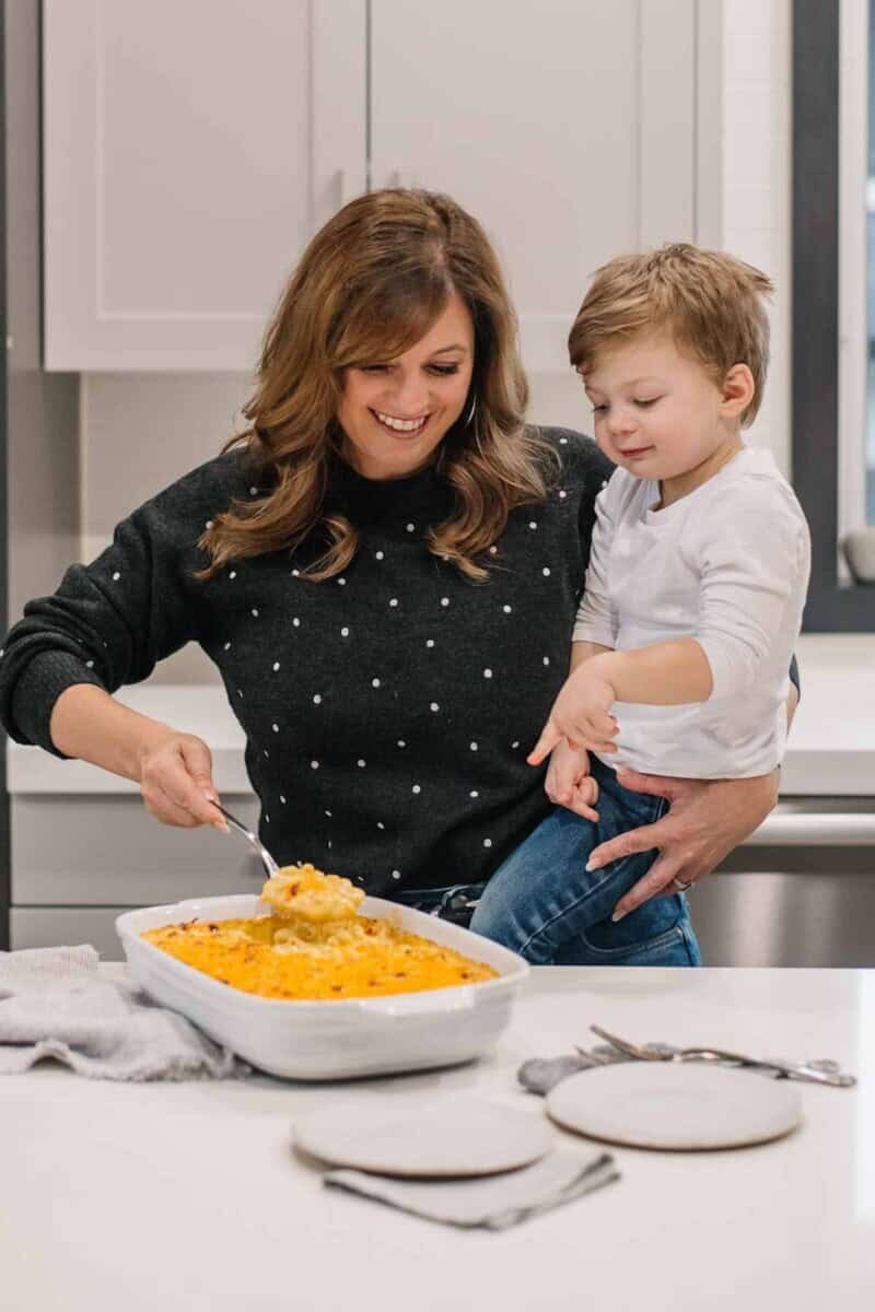 Holly Nilsson with her grandson having mac and cheese.