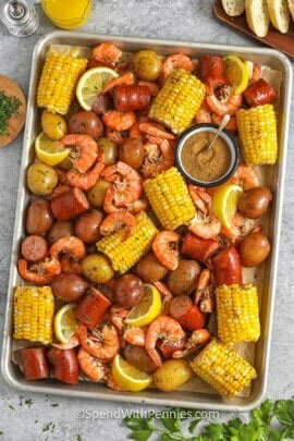 sheet pan of Shrimp Boil with seasoning