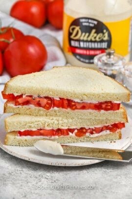 Classic Tomato Sandwich with mayonnaise on the sandwich and on a knife